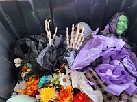 Bin with skeleton ghoul, witch, artificial flowers