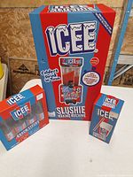 Boxed ICEE slushie machine, syrup pack, cup set group shot