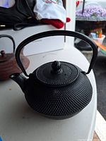 Black cast-iron Japanese teapot front view