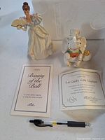Lenox princess and elephant figurines with certificates and pen for scale