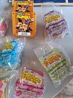 Sealed Flintstones Happy Meal toys with Crash Team Rumble boxed toy visible