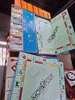 Open classic Monopoly board with components