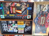 Open Star Wars Episode I Monopoly box with board, money, cards, tokens visible
