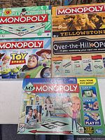 Group shot of five boxed Monopoly games
