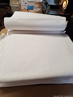 Stack of folded white sheets