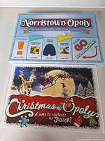 Front view of Norristown-Opoly and Christmas-Opoly boxes