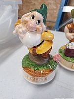 Front view of Bashful musical figurine on base