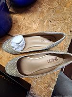 Top view glitter flats shows color, design, size label