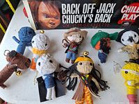 Group view of Child's Play display and eight of the voodoo dolls