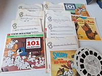 Paper sleeves for multiple View-Master reel sets and one reel visible