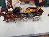 Fresh Fruits & Vegetables cast iron wagon with horses, cargo visible