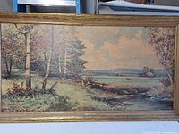 Framed Robert Wood landscape print showing creek, trees and meadow