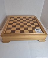 Closed wood case with chessboard top