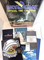 Group shot showing calendar, brochures, program, VHS, roof souvenir