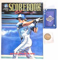 Group shot: yearbook, playing card deck, coin