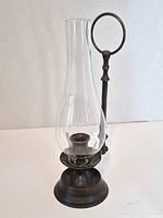 Candleholder assembled with glass chimney