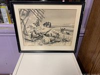 Front view of framed black-and-white signed illustration