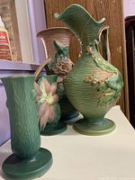 Three Roseville pottery pieces together
