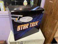 Front of retail box showing Star Trek branding and Enterprise image