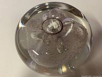 Top angled view showing internal flower form and clarity of glass