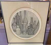 Framed print showing bottles still life