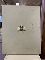 Exterior presentation box bearing Noble Games crest