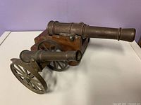 Two miniature cannons showing size, materials and design details