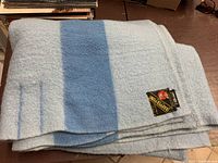 Folded wool blanket showing label and color pattern