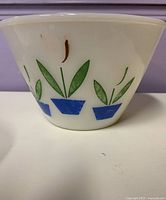 Side view showing Tulip pattern, paint loss, and bowl shape