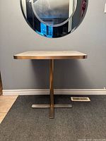 Full view showing square Formica top and steel pedestal cross base