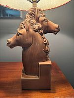 close view of ceramic double horse-head base