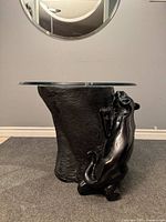 Full front view of panther side table with glass top