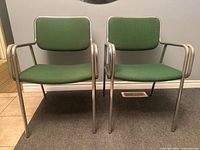 Front view of both chrome green side chairs