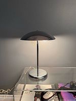 Lamp illuminated on clear acrylic side table