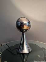 Lamp off view showing chrome finish and shape