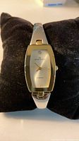 Front view of Anne Klein ladies watch on black pillow