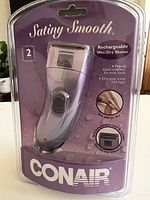 Front of sealed package showing Conair Satiny Smooth rechargeable wet/dry shaver
