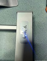 Close-up of silver control panel showing 4H, 2H, ON/OFF buttons