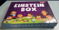 Front view of sealed Einstein Box showing title and age range