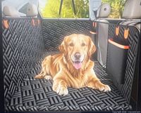 Marketing image showing the Elemax back seat pet extender installed with dog lying on flat surface