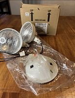 Box with model label and fixture components