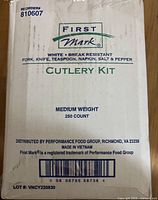 Front of First Mark Cutlery Kit box showing branding, contents, and 250 count