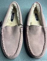 Top view of both slippers showing pink suede and fleece lining
