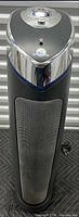Full view of GermGuardian tower air purifier showing front grill, control panel and power cord