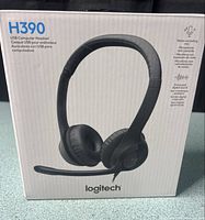 Front of sealed Logitech H390 retail box showing product image and model