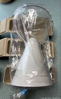 Glass carafe and filter funnel sealed in plastic with cardboard packing