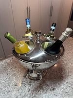 cooler with four bottles inserted showing size and lid design