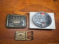 Group shot of the three belt buckles