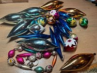 Group view of all mercury glass ornaments and garland