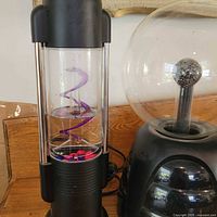 Large plasma ball and water motion lamp side by side